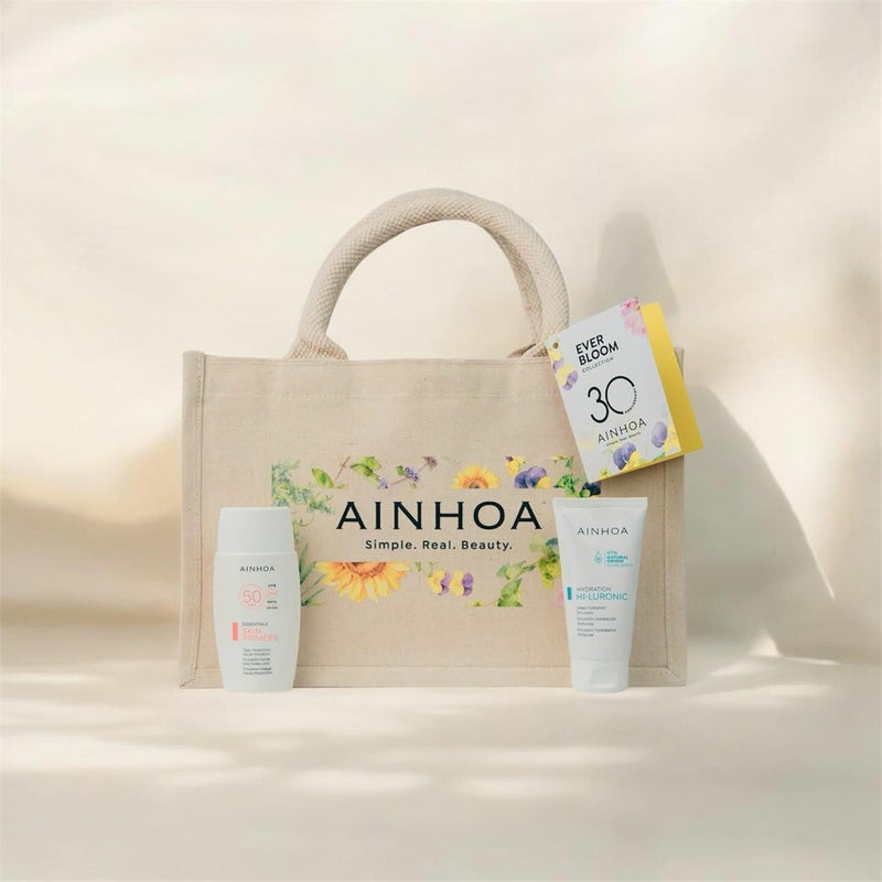 Bolsa Ainhoa Ever Bloom con protector SPF50 y emulsión Hi-Luronic